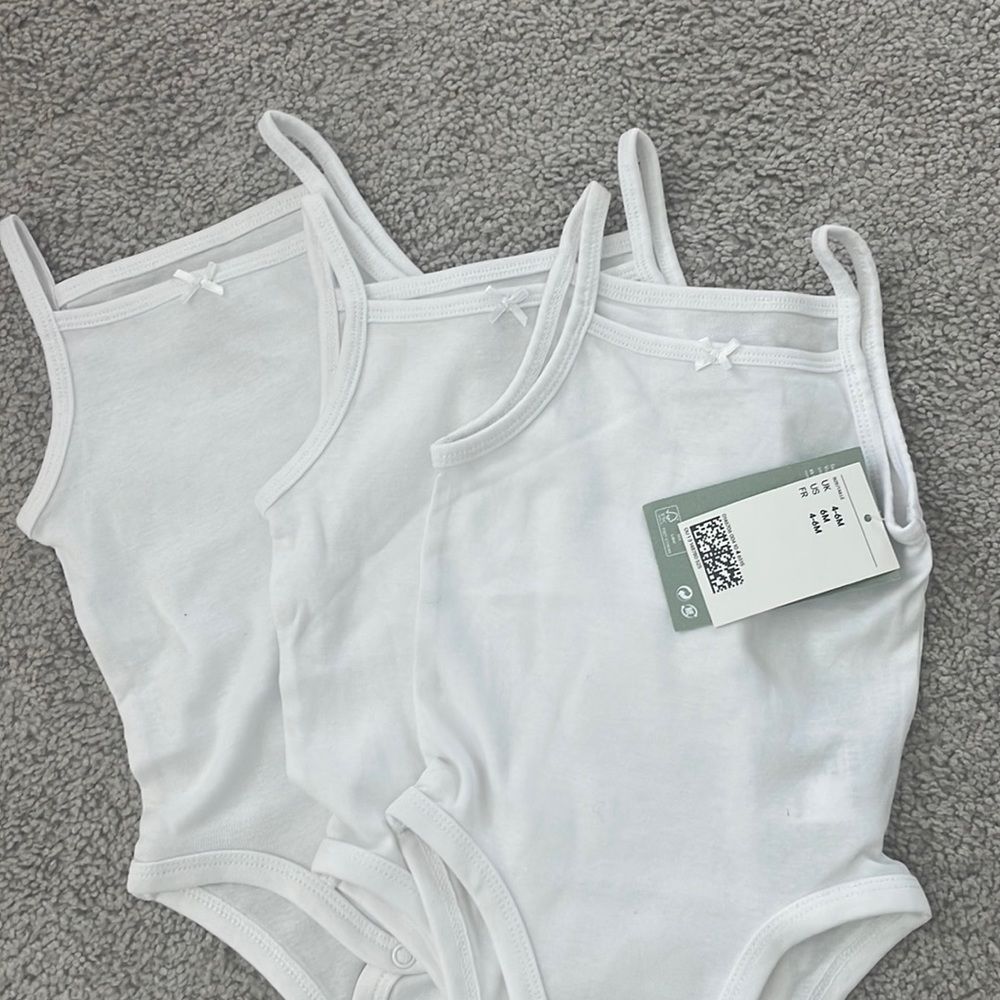 Brand new set of 3 H&M onesies. 4-6 months